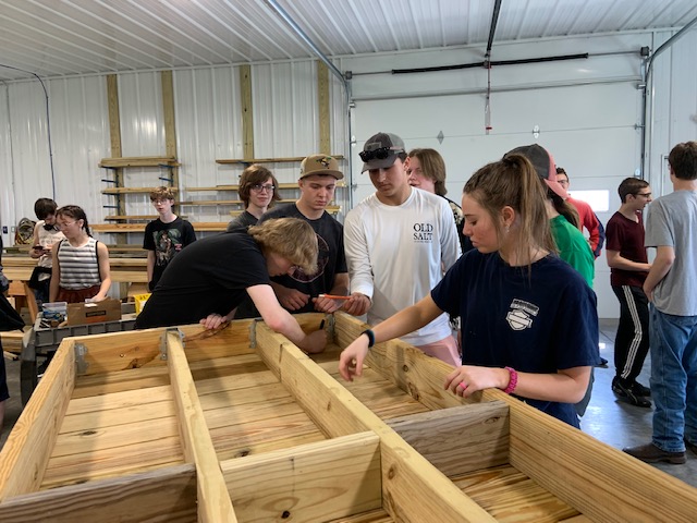 At Rebuilding Together in Atkinson, students worked together to help assemble much-needed wheelchair ramps.